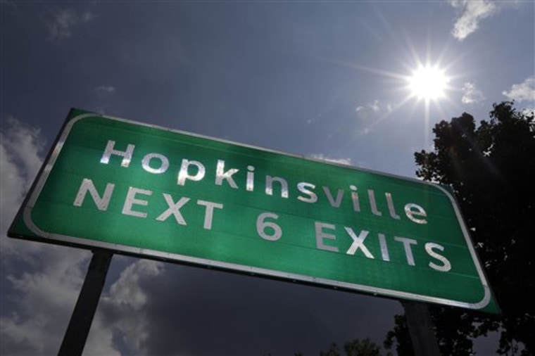 A road sign for Hopkinsville, Ky., rises beneath the afternoon sun. When a total solar eclipse darkens the skies over parts of the United States on Aug. 21, 2017, the afternoon event will last longer in a rural stretch near Hopkinsville than in any other place on the planet.